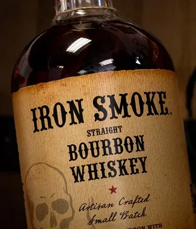 Close-up of a bourbon bottle on a store shelf